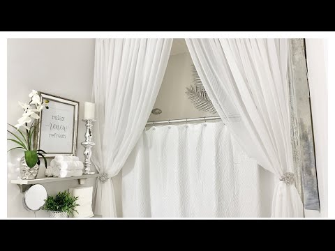 Which color towels complement a gray bathroom?